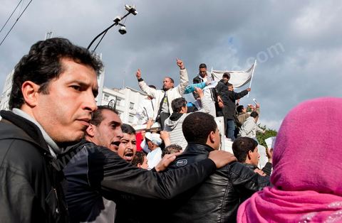 A funeral procession for a victim of police violence passed through downtown Tunis, from the Passage to Habib Bourguiba Avenue, joining the large demonstration on Friday, January 14, in front of the Ministry of the Interior on Habib Bourguiba Avenue. As these peaceful demonstrators passed by, the police gave the order to fire tear gas canisters to disperse the crowd. Meanwhile, former President Ben Ali was fleeing the country. 