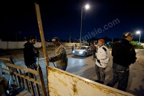 After the 6 p.m. curfew: Roadblocks and patrols set up by citizens in collaboration with the armed forces in every neighborhood of Tunis. Here in the working-class neighborhoods of Megrine Chaker in the southern suburbs of Tunis