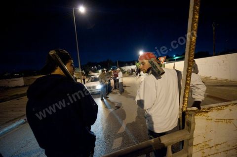 After the 6 p.m. curfew: Roadblocks and patrols set up by citizens in collaboration with the armed forces in every neighborhood of Tunis. Here in the working-class neighborhoods of Megrine Chaker in the southern suburbs of Tunis
