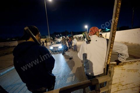 After the 6 p.m. curfew: Roadblocks and patrols set up by citizens in collaboration with the armed forces in every neighborhood of Tunis. Here in the working-class neighborhoods of Megrine Chaker in the southern suburbs of Tunis