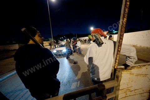 After the 6 p.m. curfew: Roadblocks and patrols set up by citizens in collaboration with the armed forces in every neighborhood of Tunis. Here in the working-class neighborhoods of Megrine Chaker in the southern suburbs of Tunis