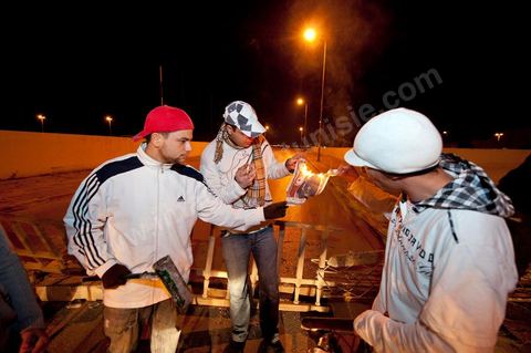 After the 6 p.m. curfew: Roadblocks and patrols set up by citizens in collaboration with the armed forces in every neighborhood of Tunis. Here in the working-class neighborhoods of Megrine Chaker in the southern suburbs of Tunis
