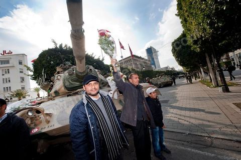 January 19, 2011; a scene of the people gathered with the Tunisian army around tanks on Habib Bourguiba Avenue in Tunis