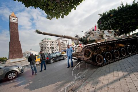 January 19, 2011; a scene of the people gathered with the Tunisian army around tanks on Habib Bourguiba Avenue in Tunis