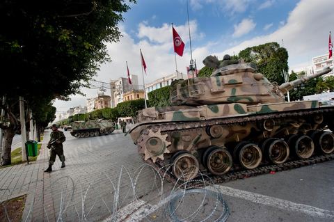 January 19, 2011; a scene of the people gathered with the Tunisian army around tanks on Habib Bourguiba Avenue in Tunis