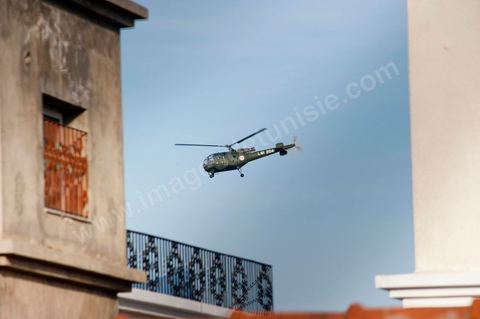 Army helicopter flying over residential neighborhoods in the southern suburbs of Tunis