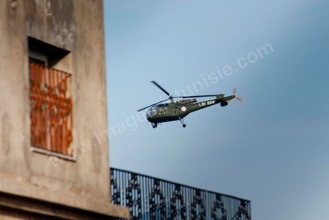 Army helicopter flying over residential neighborhoods in the southern suburbs of Tunis