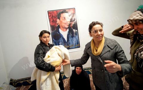 February 9: Mohamed’s sisters with Omar, the newborn son of Salem, Mohamed’s brother, born on December 17, 2010—the day Mohamed Bouazizi set himself on fire. At Mohamed Bouazizi’s home on the 40th day after his death. With his immediate family—his mother, uncle, brother, and sisters—and friends from the neighborhood, they celebrated the 40th day since Mohamed Bouazizi’s death. In Muslim culture, the 40th day is the day when the soul of the deceased leaves the earth to enter paradise, but it is also the day when the family must accept the departure of their loved one—the day when the period of mourning is declared over. On this day, close relatives gather to eat at the home of the deceased’s family.