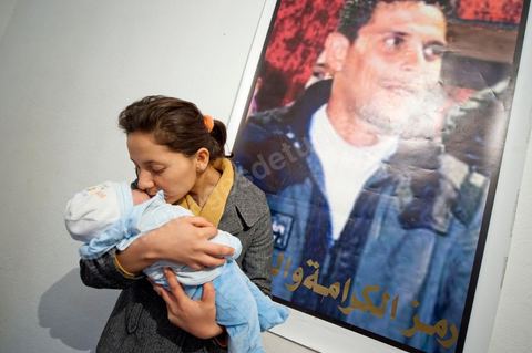 February 9: Leila, Mohamed’s sister, with Omar, the newborn son of Salem, Mohamed’s brother, born on December 17, 2010—the day Mohamed Bouazizi set himself on fire. At Mohamed Bouazizi’s home on the 40th day after his death. Together with his immediate family—his mother, uncle, brother, and sisters—and friends from the neighborhood, they celebrated the 40th day since Mohamed Bouazizi’s death. In Muslim culture, the 40th day is the day when the soul of the deceased leaves the earth to enter paradise, but it is also the day when the family must accept the departure of their loved one—the day when the period of mourning is declared over. On this day, close relatives gather to eat at the home of the deceased’s family.