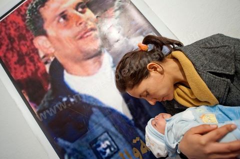 February 9: Leila, Mohamed’s sister, with Omar, the newborn son of Salem, Mohamed’s brother, born on December 17, 2010—the day Mohamed Bouazizi set himself on fire. At Mohamed Bouazizi’s home on the 40th day after his death. Together with his immediate family—his mother, uncle, brother, and sisters—and friends from the neighborhood, they celebrated the 40th day since Mohamed Bouazizi’s death. In Muslim culture, the 40th day is the day when the soul of the deceased leaves the earth to enter paradise, but it is also the day when the family must accept the departure of their loved one—the day when the period of mourning is declared over. On this day, close relatives gather to eat at the home of the deceased’s family.