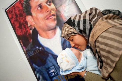February 9: Mohamed’s sister, with Omar, the newborn son of Salem, Mohamed’s brother, born on December 17, 2010—the day Mohamed Bouazizi set himself on fire. At Mohamed Bouazizi’s home on the 40th day after his death. With his immediate family—his mother, uncle, brother, and sisters—and friends from the neighborhood, they celebrated the 40th day since Mohamed Bouazizi’s death. In Muslim culture, the 40th day is the day when the soul of the deceased leaves the earth to enter paradise, but it is also the day when the family must come to terms with the loss of their loved one—the day when the period of mourning is officially declared over. On this day, close relatives gather for a meal at the home of the deceased’s family.