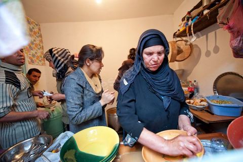 February 9: In the kitchen, Mohamed’s mother and her daughters prepare a meal for the guests at Mohamed Bouazizi’s home on the 40th day after his death. Together with his immediate family—his mother, uncle, brother, and sisters—and friends from the neighborhood, they celebrate the 40th day since Mohamed Bouazizi’s death. In Muslim culture, the 40th day is the day when the soul of the deceased leaves the earth to enter paradise; it is also the day when the family must accept the departure of their loved one—the day when the mourning period is declared over. On this day, close relatives gather to eat at the home of the deceased’s family.