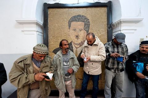 March 12, 2011: In the Rotonde’s main hall, under the watchful eye of Farhat Hached (a giant portrait) at the UGTT headquarters, a meeting of union members from a private construction company, SBF, to establish the SBF shop-floor union and elect union representatives through a vote by UGTT/SBF members. The vote was supervised by the Tunis Regional Office, chaired here by Mr. Amor Bouderbala, a member of the UGGT Tunis Executive Board. Seventeen UGTT/SBF union representatives are running for seven elected positions. At the heart of the UGTT (Tunisian General Labor Union), at its historic headquarters on Mohamed Ali Square in Tunis.