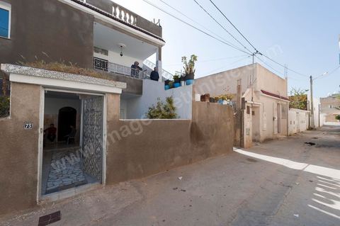 The Bouazizi Family’s New Home

Forced to leave Sidi Bouzid, where the pressure had become too much for them, the Bouazizi family found refuge 260 kilometers away, in Tunis. Mohamed Bouazizi’s mother, the iconic figure of Tunisia’s popular uprising, his sisters, and his two youngest brothers live in a house with blue ceramic tiles—a three-room ground-floor apartment—in the working-class neighborhood of Bousalsa in La Marsa, on the northern outskirts of Tunis. Leila, the 24-year-old eldest sister, is enrolled in a work-study vocational program to become a quality control inspector in the textile industry;  Semia, 19, is preparing for her high school diploma, while Basma, 16, Karim, 14, and Zyed, 8, are still in school. Only the eldest brother, Salem, lives elsewhere, in Sfax. Singled out by some residents of Sidi Bouzid, who accuse her of receiving money from the government, the Bouazizi family produces the lease for their new home, which they plan to rent for six months, through August, at a cost of 360 dinars (180 euros). Soon, the mother promises, they will return to Sidi Bouzid.