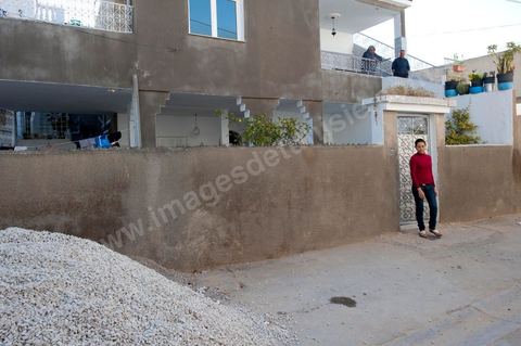 The Bouazizi Family’s New Home

Forced to leave Sidi Bouzid, where the pressure had become too much for them, the Bouazizi family found refuge 260 kilometers away, in Tunis. Mohamed Bouazizi’s mother, the iconic figure of Tunisia’s popular uprising, his sisters, and his two youngest brothers live in a house with blue ceramic tiles—a three-room ground-floor apartment—in the working-class neighborhood of Bousalsa in La Marsa, on the northern outskirts of Tunis. Leila, the 24-year-old eldest sister, is enrolled in a work-study vocational program to become a quality control inspector in the textile industry;  Semia, 19, is preparing for her high school diploma, while Basma, 16, Karim, 14, and Zyed, 8, are still in school. Only the eldest brother, Salem, lives elsewhere, in Sfax. Singled out by some residents of Sidi Bouzid, who accuse her of receiving money from the government, the Bouazizi family produces the lease for their new home, which they plan to rent for six months, through August, at a cost of 360 dinars (180 euros). Soon, the mother promises, they will return to Sidi Bouzid.