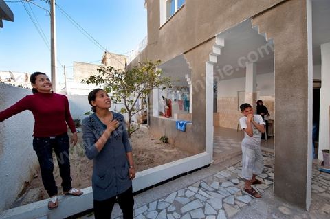 The Bouazizi Family’s New Home

Forced to leave Sidi Bouzid, where the pressure had become too much for them, the Bouazizi family found refuge 260 kilometers away, in Tunis. Mohamed Bouazizi’s mother, the iconic figure of Tunisia’s popular uprising, his sisters, and his two youngest brothers live in a house with blue ceramic tiles—a three-room ground-floor apartment—in the working-class neighborhood of Bousalsa in La Marsa, on the northern outskirts of Tunis. Leila, the 24-year-old eldest sister, is enrolled in a work-study vocational program to become a quality control inspector in the textile industry;  Semia, 19, is preparing for her high school diploma, while Basma, 16, Karim, 14, and Zyed, 8, are still in school. Only the eldest brother, Salem, lives elsewhere, in Sfax. Singled out by some residents of Sidi Bouzid, who accuse her of receiving money from the government, the Bouazizi family produces the lease for their new home, which they plan to rent for six months, through August, at a cost of 360 dinars (180 euros). Soon, the mother promises, they will return to Sidi Bouzid.
