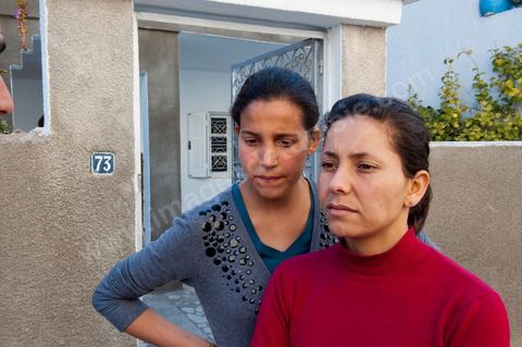 The Bouazizi Family’s New Home

Forced to leave Sidi Bouzid, where the pressure had become too much for them, the Bouazizi family found refuge 260 kilometers away, in Tunis. Mohamed Bouazizi’s mother, the iconic figure of Tunisia’s popular uprising, his sisters, and his two youngest brothers live in a house with blue ceramic tiles—a three-room ground-floor apartment—in the working-class neighborhood of Bousalsa in La Marsa, on the northern outskirts of Tunis. Leila, the 24-year-old eldest sister, is enrolled in a work-study vocational program to become a quality control inspector in the textile industry;  Semia, 19, is preparing for her high school diploma, while Basma, 16, Karim, 14, and Zyed, 8, are still in school. Only the eldest brother, Salem, lives elsewhere, in Sfax. Singled out by some residents of Sidi Bouzid, who accuse her of receiving money from the government, the Bouazizi family produces the lease for their new home, which they plan to rent for six months, through August, at a cost of 360 dinars (180 euros). Soon, the mother promises, they will return to Sidi Bouzid.