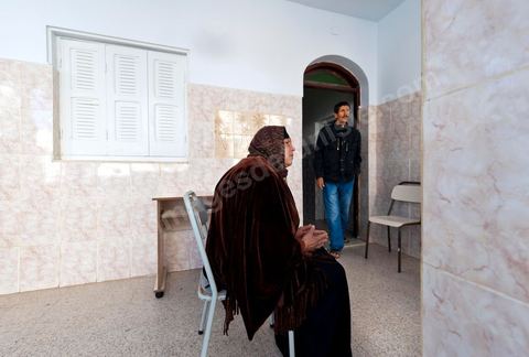 The Bouazizi Family’s New Home

Forced to leave Sidi Bouzid, where the pressure had become too much for them, the Bouazizi family found refuge 260 kilometers away, in Tunis. Mohamed Bouazizi’s mother, the iconic figure of Tunisia’s popular uprising, his sisters, and his two youngest brothers live in a house with blue ceramic tiles—a three-room ground-floor apartment—in the working-class neighborhood of Bousalsa in La Marsa, on the northern outskirts of Tunis. Leila, the 24-year-old eldest sister, is enrolled in a work-study vocational program to become a quality control inspector in the textile industry;  Semia, 19, is preparing for her high school diploma, while Basma, 16, Karim, 14, and Zyed, 8, are still in school. Only the eldest brother, Salem, lives elsewhere, in Sfax. Singled out by some residents of Sidi Bouzid, who accuse her of receiving money from the government, the Bouazizi family produces the lease for their new home, which they plan to rent for six months, through August, at a cost of 360 dinars (180 euros). Soon, the mother promises, they will return to Sidi Bouzid.
