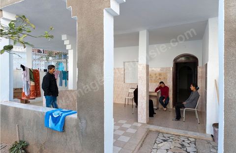The Bouazizi Family’s New Home

Forced to leave Sidi Bouzid, where the pressure had become too much for them, the Bouazizi family found refuge 260 kilometers away, in Tunis. Mohamed Bouazizi’s mother, the iconic figure of Tunisia’s popular uprising, his sisters, and his two youngest brothers live in a house with blue ceramic tiles—a three-room ground-floor apartment—in the working-class neighborhood of Bousalsa in La Marsa, on the northern outskirts of Tunis. Leila, the 24-year-old eldest sister, is enrolled in a work-study vocational program to become a quality control inspector in the textile industry;  Semia, 19, is preparing for her high school diploma, while Basma, 16, Karim, 14, and Zyed, 8, are still in school. Only the eldest brother, Salem, lives elsewhere, in Sfax. Singled out by some residents of Sidi Bouzid, who accuse her of receiving money from the government, the Bouazizi family produces the lease for their new home, which they plan to rent for six months, through August, at a cost of 360 dinars (180 euros). Soon, the mother promises, they will return to Sidi Bouzid.