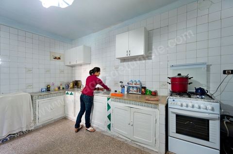 The Bouazizi Family’s New Home

Forced to leave Sidi Bouzid, where the pressure had become too much for them, the Bouazizi family found refuge 260 kilometers away, in Tunis. Mohamed Bouazizi’s mother, the iconic figure of Tunisia’s popular uprising, his sisters, and his two youngest brothers live in a house with blue ceramic tiles—a three-room ground-floor apartment—in the working-class neighborhood of Bousalsa in La Marsa, on the northern outskirts of Tunis. Leila, the 24-year-old eldest sister, is enrolled in a work-study vocational program to become a quality control inspector in the textile industry;  Semia, 19, is preparing for her high school diploma, while Basma, 16, Karim, 14, and Zyed, 8, are still in school. Only the eldest brother, Salem, lives elsewhere, in Sfax. Singled out by some residents of Sidi Bouzid, who accuse her of receiving money from the government, the Bouazizi family produces the lease for their new home, which they plan to rent for six months, through August, at a cost of 360 dinars (180 euros). Soon, the mother promises, they will return to Sidi Bouzid.