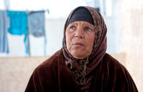 The Bouazizi Family’s New Home

Forced to leave Sidi Bouzid, where the pressure had become too much for them, the Bouazizi family found refuge 260 kilometers away, in Tunis. Mohamed Bouazizi’s mother, the iconic figure of Tunisia’s popular uprising, his sisters, and his two youngest brothers live in a house with blue ceramic tiles—a three-room ground-floor apartment—in the working-class neighborhood of Bousalsa in La Marsa, on the northern outskirts of Tunis. Leila, the 24-year-old eldest sister, is enrolled in a work-study vocational program to become a quality control inspector in the textile industry;  Semia, 19, is preparing for her high school diploma, while Basma, 16, Karim, 14, and Zyed, 8, are still in school. Only the eldest brother, Salem, lives elsewhere, in Sfax. Singled out by some residents of Sidi Bouzid, who accuse her of receiving money from the government, the Bouazizi family produces the lease for their new home, which they plan to rent for six months, through August, at a cost of 360 dinars (180 euros). Soon, the mother promises, they will return to Sidi Bouzid.