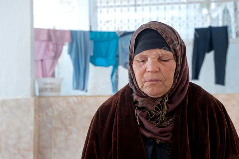 The Bouazizi Family’s New Home

Forced to leave Sidi Bouzid, where the pressure had become too much for them, the Bouazizi family found refuge 260 kilometers away, in Tunis. Mohamed Bouazizi’s mother, the iconic figure of Tunisia’s popular uprising, his sisters, and his two youngest brothers live in a house with blue ceramic tiles—a three-room ground-floor apartment—in the working-class neighborhood of Bousalsa in La Marsa, on the northern outskirts of Tunis. Leila, the 24-year-old eldest sister, is enrolled in a work-study vocational program to become a quality control inspector in the textile industry;  Semia, 19, is preparing for her high school diploma, while Basma, 16, Karim, 14, and Zyed, 8, are still in school. Only the eldest brother, Salem, lives elsewhere, in Sfax. Singled out by some residents of Sidi Bouzid, who accuse her of receiving money from the government, the Bouazizi family produces the lease for their new home, which they plan to rent for six months, through August, at a cost of 360 dinars (180 euros). Soon, the mother promises, they will return to Sidi Bouzid.
