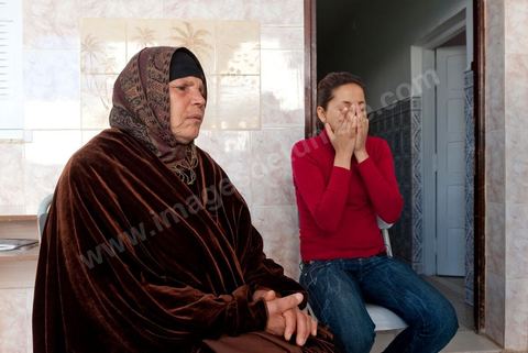 The Bouazizi Family’s New Home

Forced to leave Sidi Bouzid, where the pressure had become too much for them, the Bouazizi family found refuge 260 kilometers away, in Tunis. Mohamed Bouazizi’s mother, the iconic figure of Tunisia’s popular uprising, his sisters, and his two youngest brothers live in a house with blue ceramic tiles—a three-room ground-floor apartment—in the working-class neighborhood of Bousalsa in La Marsa, on the northern outskirts of Tunis. Leila, the 24-year-old eldest sister, is enrolled in a work-study vocational program to become a quality control inspector in the textile industry;  Semia, 19, is preparing for her high school diploma, while Basma, 16, Karim, 14, and Zyed, 8, are still in school. Only the eldest brother, Salem, lives elsewhere, in Sfax. Singled out by some residents of Sidi Bouzid, who accuse her of receiving money from the government, the Bouazizi family produces the lease for their new home, which they plan to rent for six months, through August, at a cost of 360 dinars (180 euros). Soon, the mother promises, they will return to Sidi Bouzid.