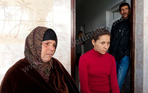 The Bouazizi Family’s New Home

Forced to leave Sidi Bouzid, where the pressure had become too much for them, the Bouazizi family found refuge 260 kilometers away, in Tunis. Mohamed Bouazizi’s mother, the iconic figure of Tunisia’s popular uprising, his sisters, and his two youngest brothers live in a house with blue ceramic tiles—a three-room ground-floor apartment—in the working-class neighborhood of Bousalsa in La Marsa, on the northern outskirts of Tunis. Leila, the 24-year-old eldest sister, is enrolled in a work-study vocational program to become a quality control inspector in the textile industry;  Semia, 19, is preparing for her high school diploma, while Basma, 16, Karim, 14, and Zyed, 8, are still in school. Only the eldest brother, Salem, lives elsewhere, in Sfax. Singled out by some residents of Sidi Bouzid, who accuse her of receiving money from the government, the Bouazizi family produces the lease for their new home, which they plan to rent for six months, through August, at a cost of 360 dinars (180 euros). Soon, the mother promises, they will return to Sidi Bouzid.