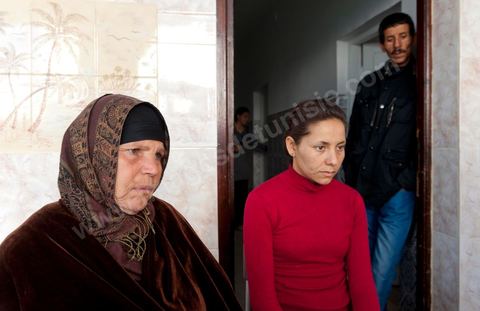 The Bouazizi Family’s New Home

Forced to leave Sidi Bouzid, where the pressure had become too much for them, the Bouazizi family found refuge 260 kilometers away, in Tunis. Mohamed Bouazizi’s mother, the iconic figure of Tunisia’s popular uprising, his sisters, and his two youngest brothers live in a house with blue ceramic tiles—a three-room ground-floor apartment—in the working-class neighborhood of Bousalsa in La Marsa, on the northern outskirts of Tunis. Leila, the 24-year-old eldest sister, is enrolled in a work-study vocational program to become a quality control inspector in the textile industry;  Semia, 19, is preparing for her high school diploma, while Basma, 16, Karim, 14, and Zyed, 8, are still in school. Only the eldest brother, Salem, lives elsewhere, in Sfax. Singled out by some residents of Sidi Bouzid, who accuse her of receiving money from the government, the Bouazizi family produces the lease for their new home, which they plan to rent for six months, through August, at a cost of 360 dinars (180 euros). Soon, the mother promises, they will return to Sidi Bouzid.