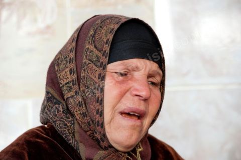 The Bouazizi Family’s New Home

Forced to leave Sidi Bouzid, where the pressure had become too much for them, the Bouazizi family found refuge 260 kilometers away, in Tunis. Mohamed Bouazizi’s mother, the iconic figure of Tunisia’s popular uprising, his sisters, and his two youngest brothers live in a house with blue ceramic tiles—a three-room ground-floor apartment—in the working-class neighborhood of Bousalsa in La Marsa, on the northern outskirts of Tunis. Leila, the 24-year-old eldest sister, is enrolled in a work-study vocational program to become a quality control inspector in the textile industry;  Semia, 19, is preparing for her high school diploma, while Basma, 16, Karim, 14, and Zyed, 8, are still in school. Only the eldest brother, Salem, lives elsewhere, in Sfax. Singled out by some residents of Sidi Bouzid, who accuse her of receiving money from the government, the Bouazizi family produces the lease for their new home, which they plan to rent for six months, through August, at a cost of 360 dinars (180 euros). Soon, the mother promises, they will return to Sidi Bouzid.