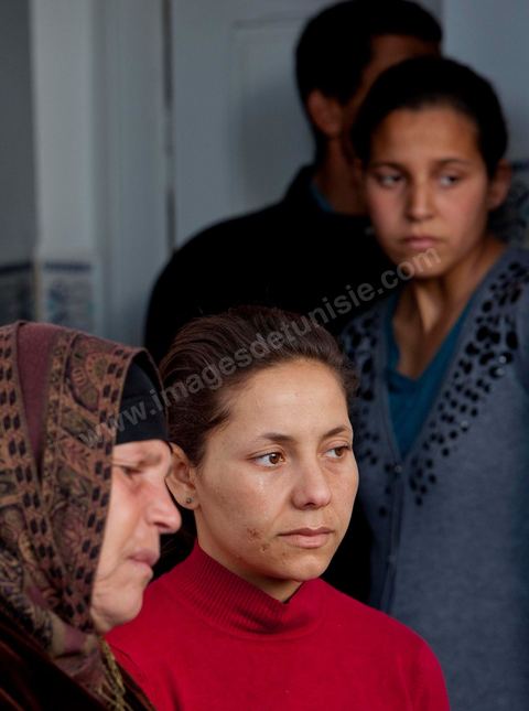 The Bouazizi Family’s New Home

Forced to leave Sidi Bouzid, where the pressure had become too much for them, the Bouazizi family found refuge 260 kilometers away, in Tunis. Mohamed Bouazizi’s mother, the iconic figure of Tunisia’s popular uprising, his sisters, and his two youngest brothers live in a house with blue ceramic tiles—a three-room ground-floor apartment—in the working-class neighborhood of Bousalsa in La Marsa, on the northern outskirts of Tunis. Leila, the 24-year-old eldest sister, is enrolled in a work-study vocational program to become a quality control inspector in the textile industry;  Semia, 19, is preparing for her high school diploma, while Basma, 16, Karim, 14, and Zyed, 8, are still in school. Only the eldest brother, Salem, lives elsewhere, in Sfax. Singled out by some residents of Sidi Bouzid, who accuse her of receiving money from the government, the Bouazizi family produces the lease for their new home, which they plan to rent for six months, through August, at a cost of 360 dinars (180 euros). Soon, the mother promises, they will return to Sidi Bouzid.