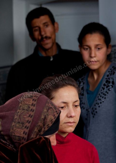 The Bouazizi Family’s New Home

Forced to leave Sidi Bouzid, where the pressure had become too much for them, the Bouazizi family found refuge 260 kilometers away, in Tunis. Mohamed Bouazizi’s mother, the iconic figure of Tunisia’s popular uprising, his sisters, and his two youngest brothers live in a house with blue ceramic tiles—a three-room ground-floor apartment—in the working-class neighborhood of Bousalsa in La Marsa, on the northern outskirts of Tunis. Leila, the 24-year-old eldest sister, is enrolled in a work-study vocational program to become a quality control inspector in the textile industry;  Semia, 19, is preparing for her high school diploma, while Basma, 16, Karim, 14, and Zyed, 8, are still in school. Only the eldest brother, Salem, lives elsewhere, in Sfax. Singled out by some residents of Sidi Bouzid, who accuse her of receiving money from the government, the Bouazizi family produces the lease for their new home, which they plan to rent for six months, through August, at a cost of 360 dinars (180 euros). Soon, the mother promises, they will return to Sidi Bouzid.