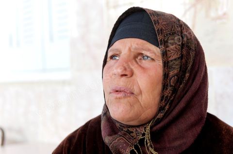 The Bouazizi Family’s New Home

Forced to leave Sidi Bouzid, where the pressure had become too much for them, the Bouazizi family found refuge 260 kilometers away, in Tunis. Mohamed Bouazizi’s mother, the iconic figure of Tunisia’s popular uprising, his sisters, and his two youngest brothers live in a house with blue ceramic tiles—a three-room ground-floor apartment—in the working-class neighborhood of Bousalsa in La Marsa, on the northern outskirts of Tunis. Leila, the 24-year-old eldest sister, is enrolled in a work-study vocational program to become a quality control inspector in the textile industry;  Semia, 19, is preparing for her high school diploma, while Basma, 16, Karim, 14, and Zyed, 8, are still in school. Only the eldest brother, Salem, lives elsewhere, in Sfax. Singled out by some residents of Sidi Bouzid, who accuse her of receiving money from the government, the Bouazizi family produces the lease for their new home, which they plan to rent for six months, through August, at a cost of 360 dinars (180 euros). Soon, the mother promises, they will return to Sidi Bouzid.