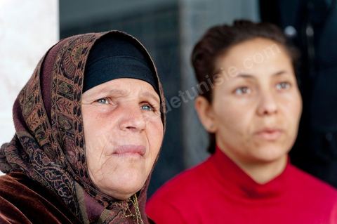 The Bouazizi Family’s New Home

Forced to leave Sidi Bouzid, where the pressure had become too much for them, the Bouazizi family found refuge 260 kilometers away, in Tunis. Mohamed Bouazizi’s mother, the iconic figure of Tunisia’s popular uprising, his sisters, and his two youngest brothers live in a house with blue ceramic tiles—a three-room ground-floor apartment—in the working-class neighborhood of Bousalsa in La Marsa, on the northern outskirts of Tunis. Leila, the 24-year-old eldest sister, is enrolled in a work-study vocational program to become a quality control inspector in the textile industry;  Semia, 19, is preparing for her high school diploma, while Basma, 16, Karim, 14, and Zyed, 8, are still in school. Only the eldest brother, Salem, lives elsewhere, in Sfax. Singled out by some residents of Sidi Bouzid, who accuse her of receiving money from the government, the Bouazizi family produces the lease for their new home, which they plan to rent for six months, through August, at a cost of 360 dinars (180 euros). Soon, the mother promises, they will return to Sidi Bouzid.