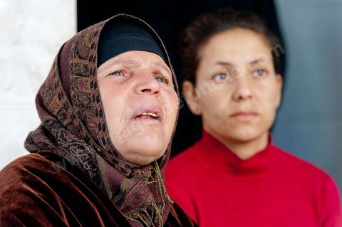 The Bouazizi Family’s New Home

Forced to leave Sidi Bouzid, where the pressure had become too much for them, the Bouazizi family found refuge 260 kilometers away, in Tunis. Mohamed Bouazizi’s mother, the iconic figure of Tunisia’s popular uprising, his sisters, and his two youngest brothers live in a house with blue ceramic tiles—a three-room ground-floor apartment—in the working-class neighborhood of Bousalsa in La Marsa, on the northern outskirts of Tunis. Leila, the 24-year-old eldest sister, is enrolled in a work-study vocational program to become a quality control inspector in the textile industry;  Semia, 19, is preparing for her high school diploma, while Basma, 16, Karim, 14, and Zyed, 8, are still in school. Only the eldest brother, Salem, lives elsewhere, in Sfax. Singled out by some residents of Sidi Bouzid, who accuse her of receiving money from the government, the Bouazizi family produces the lease for their new home, which they plan to rent for six months, through August, at a cost of 360 dinars (180 euros). Soon, the mother promises, they will return to Sidi Bouzid.