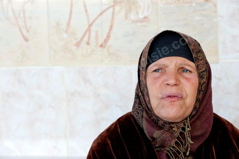 The Bouazizi Family’s New Home

Forced to leave Sidi Bouzid, where the pressure had become too much for them, the Bouazizi family found refuge 260 kilometers away, in Tunis. Mohamed Bouazizi’s mother, the iconic figure of Tunisia’s popular uprising, his sisters, and his two youngest brothers live in a house with blue ceramic tiles—a three-room ground-floor apartment—in the working-class neighborhood of Bousalsa in La Marsa, on the northern outskirts of Tunis. Leila, the 24-year-old eldest sister, is enrolled in a work-study vocational program to become a quality control inspector in the textile industry;  Semia, 19, is preparing for her high school diploma, while Basma, 16, Karim, 14, and Zyed, 8, are still in school. Only the eldest brother, Salem, lives elsewhere, in Sfax. Singled out by some residents of Sidi Bouzid, who accuse her of receiving money from the government, the Bouazizi family produces the lease for their new home, which they plan to rent for six months, through August, at a cost of 360 dinars (180 euros). Soon, the mother promises, they will return to Sidi Bouzid.