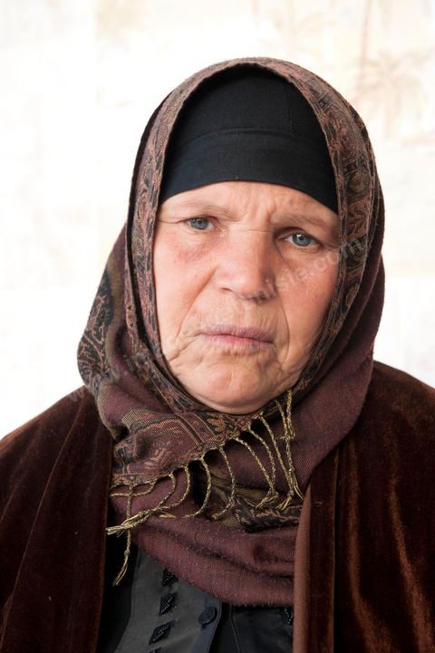 The Bouazizi Family’s New Home

Forced to leave Sidi Bouzid, where the pressure had become too much for them, the Bouazizi family found refuge 260 kilometers away, in Tunis. Mohamed Bouazizi’s mother, the iconic figure of Tunisia’s popular uprising, his sisters, and his two youngest brothers live in a house with blue ceramic tiles—a three-room ground-floor apartment—in the working-class neighborhood of Bousalsa in La Marsa, on the northern outskirts of Tunis. Leila, the 24-year-old eldest sister, is enrolled in a work-study vocational program to become a quality control inspector in the textile industry;  Semia, 19, is preparing for her high school diploma, while Basma, 16, Karim, 14, and Zyed, 8, are still in school. Only the eldest brother, Salem, lives elsewhere, in Sfax. Singled out by some residents of Sidi Bouzid, who accuse her of receiving money from the government, the Bouazizi family produces the lease for their new home, which they plan to rent for six months, through August, at a cost of 360 dinars (180 euros). Soon, the mother promises, they will return to Sidi Bouzid.