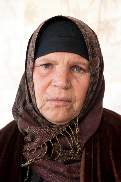 The Bouazizi Family’s New Home

Forced to leave Sidi Bouzid, where the pressure had become too much for them, the Bouazizi family found refuge 260 kilometers away, in Tunis. Mohamed Bouazizi’s mother, the iconic figure of Tunisia’s popular uprising, his sisters, and his two youngest brothers live in a house with blue ceramic tiles—a three-room ground-floor apartment—in the working-class neighborhood of Bousalsa in La Marsa, on the northern outskirts of Tunis. Leila, the 24-year-old eldest sister, is enrolled in a work-study vocational program to become a quality control inspector in the textile industry;  Semia, 19, is preparing for her high school diploma, while Basma, 16, Karim, 14, and Zyed, 8, are still in school. Only the eldest brother, Salem, lives elsewhere, in Sfax. Singled out by some residents of Sidi Bouzid, who accuse her of receiving money from the government, the Bouazizi family produces the lease for their new home, which they plan to rent for six months, through August, at a cost of 360 dinars (180 euros). Soon, the mother promises, they will return to Sidi Bouzid.