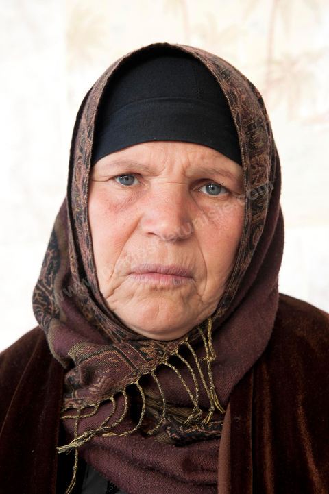 The Bouazizi Family’s New Home

Forced to leave Sidi Bouzid, where the pressure had become too much for them, the Bouazizi family found refuge 260 kilometers away, in Tunis. Mohamed Bouazizi’s mother, the iconic figure of Tunisia’s popular uprising, his sisters, and his two youngest brothers live in a house with blue ceramic tiles—a three-room ground-floor apartment—in the working-class neighborhood of Bousalsa in La Marsa, on the northern outskirts of Tunis. Leila, the 24-year-old eldest sister, is enrolled in a work-study vocational program to become a quality control inspector in the textile industry;  Semia, 19, is preparing for her high school diploma, while Basma, 16, Karim, 14, and Zyed, 8, are still in school. Only the eldest brother, Salem, lives elsewhere, in Sfax. Singled out by some residents of Sidi Bouzid, who accuse her of receiving money from the government, the Bouazizi family produces the lease for their new home, which they plan to rent for six months, through August, at a cost of 360 dinars (180 euros). Soon, the mother promises, they will return to Sidi Bouzid.