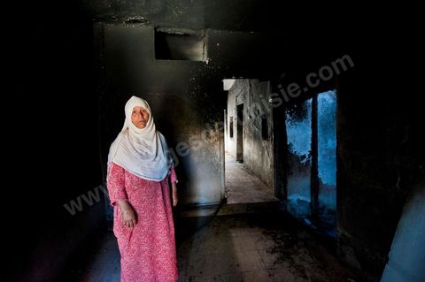 A woman from the Jeridian tribe in her burned-out home in the Tripolitain neighborhood during the clashes of June 3–5, 2011, in the city of Metlaoui