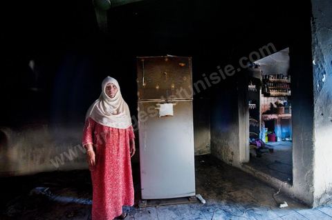 A woman from the Jeridian tribe in her burned-out home in the Tripolitain neighborhood during the clashes of June 3–5, 2011, in the city of Metlaoui