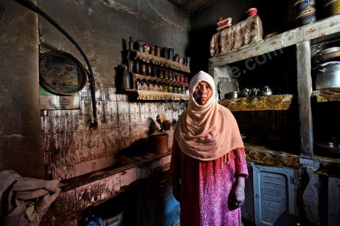 A woman from the Jeridian tribe in her burned-out home in the Tripolitain neighborhood during the clashes of June 3–5, 2011, in the city of Metlaoui