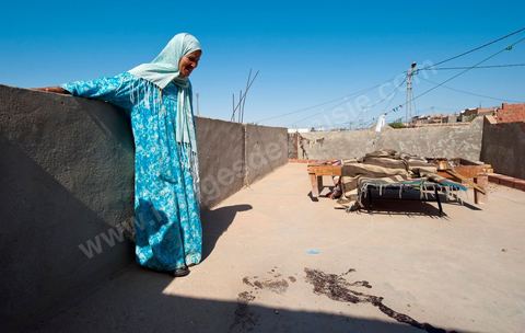 A mother mourns the death of her daughter, who was shot and killed on the porch of their home following the clashes that took place from June 3 to 5, 2011, in the town of Metlaoui