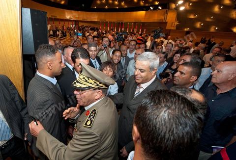 August 18: General Rachid Ammar, Chief of the Armed Forces, at the address by Tunisia’s interim Prime Minister, Mr. Béji Caïd Essebsi, at the Tunis Convention Center. Tunisian Prime Minister Béji Caïd Essebsi assured the nation on Thursday that his government was doing “the impossible” to successfully complete the transition and lead the country to elections, in an address to the nation delivered at the Tunis Convention Center.“We have done the impossible,” Mr. Caïd Essebsi declared in a 40-minute speech—delivered in the form of a plea—before some 250 political figures and representatives of civil society.“The government is fulfilling its responsibilities despite the difficulties,” added the prime minister, referring to a “very difficult” economic and social situation and affirming that he hears “the people’s demands.”“Our fundamental goal is to hold the election for the Constituent Assembly on October 23 and to organize a free and transparent vote. If we do not succeed, our government will have failed, and the revolution will have failed,” declared the prime minister, who is facing growing protests.Mr. Caïd Essebsi’s transitional government has been leading the country since late February, following the fall of President Zine el Abidine Ben Ali’s regime, which was ousted from power on January 14 by a popular uprising.