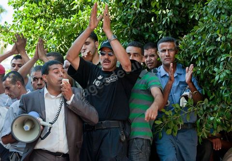 September 6, 2011: At Kasbah Square, police officers protested and occupied Government Square for a demonstration and sit-in. The police officers even entered the Prime Minister’s Office, demanding that the interim Prime Minister, Mr. Béji Caïd Essebsi, apologize for remarks he made that morning during his press conference, in which he called for the dissolution of law enforcement unions. In an address to the Tunisian people, the prime minister announced, to that end, a series of security measures, particularly the strict enforcement of the state of emergency in effect since the January 14 revolution.The government, he said, “will no longer tolerate practices that risk paralyzing the daily lives of Tunisians, such as blocking roads, attacking police stations and government facilities in the regions, and assaulting the national security forces and the army.”In this context, the Prime Minister announced the suspension of all union activities by the security forces and the dissolution of their union. He expressed surprise at the content of the statement released by the Union of Internal Security Forces, which, he noted, contained “insinuations of rebellion.”