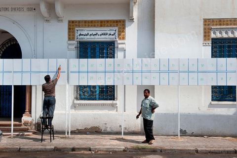 In downtown Houmt Souk on Djerba, on the eve of the start of the election campaign on October 1, final preparations are underway for the election posters—here, 43 slates.