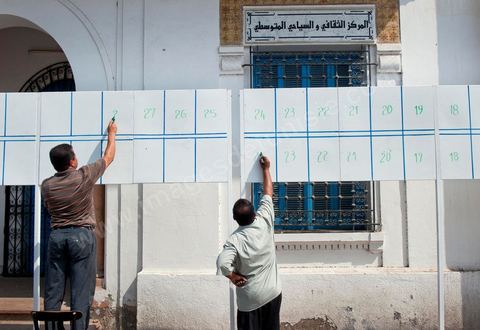In downtown Houmt Souk on Djerba, on the eve of the start of the election campaign on October 1, final preparations are underway for the election posters—here, 43 slates.