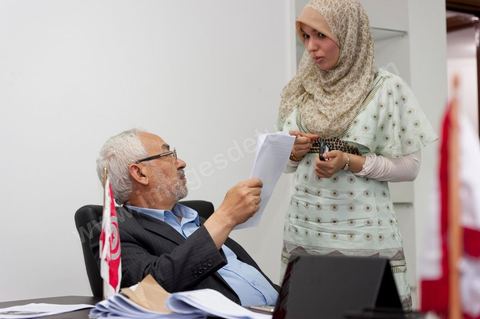 In his office, Rached Ghannouchi and his daughter Intissar are watching the election results being announced on TV during the election night event at the Ennahda party headquarters in Tunis. 