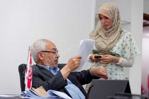 In his office, Rached Ghannouchi and his daughter Intissar are watching the election results being announced on TV during the election night event at the Ennahda party headquarters in Tunis. 