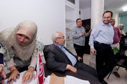 In the office of Rached Ghannouchi, president and founder of Ennahda, his daughters Intissar and [name] are noting down the preliminary results during the election night event at Ennahda’s party headquarters in Tunis. 